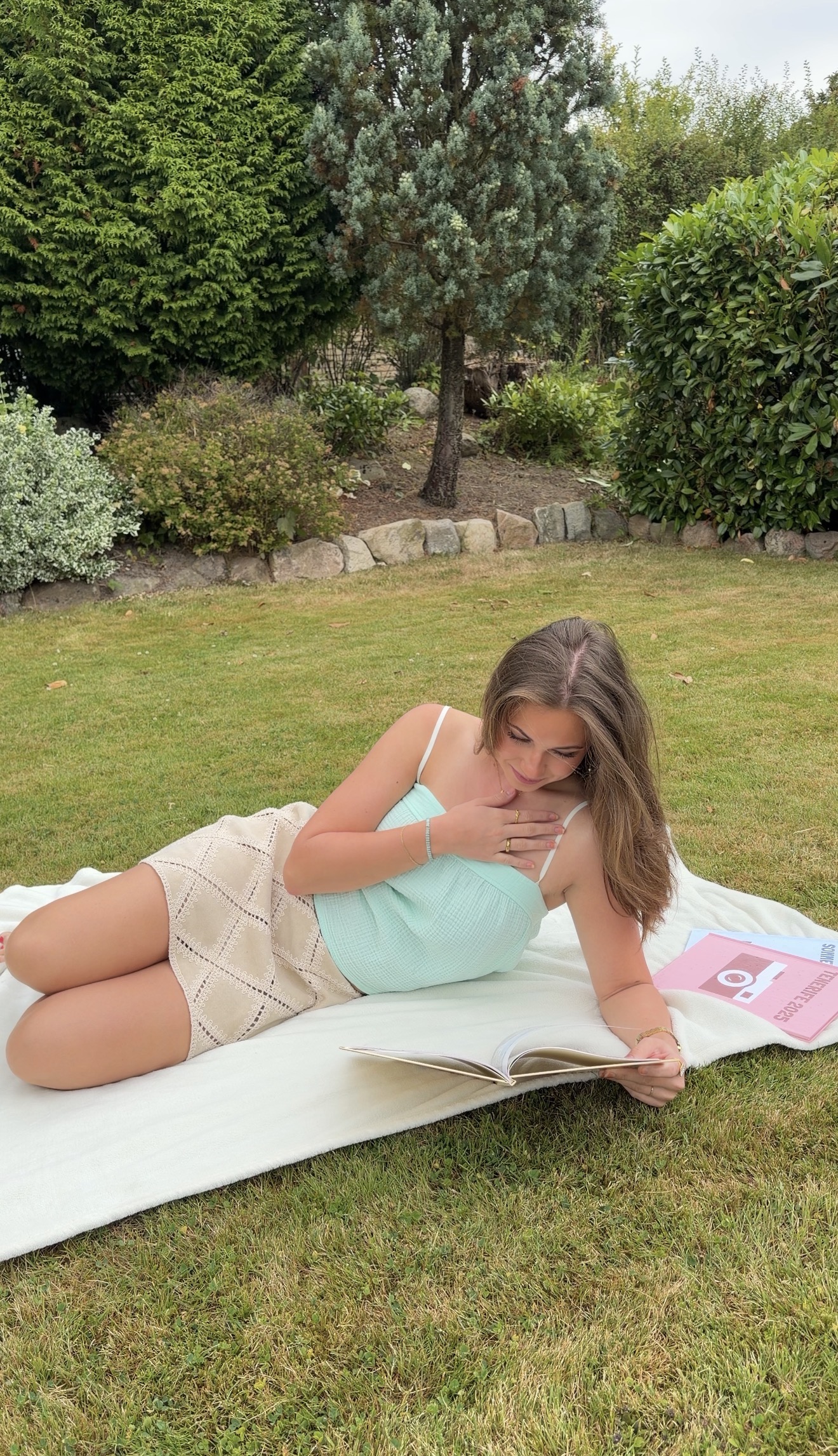 Lifestyle photo of Julie reading outdoors
